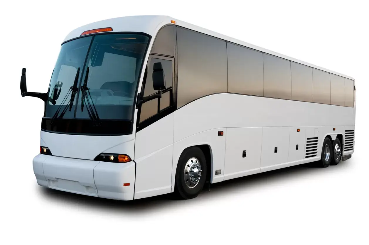 Passenger bus shot at dawn with warm glow reflected in windows. This image is isolated on a white background.